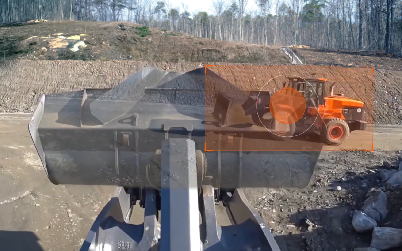A picture demonstrating the DEVELON Transparent Bucket feature and enhanced operator visibility.