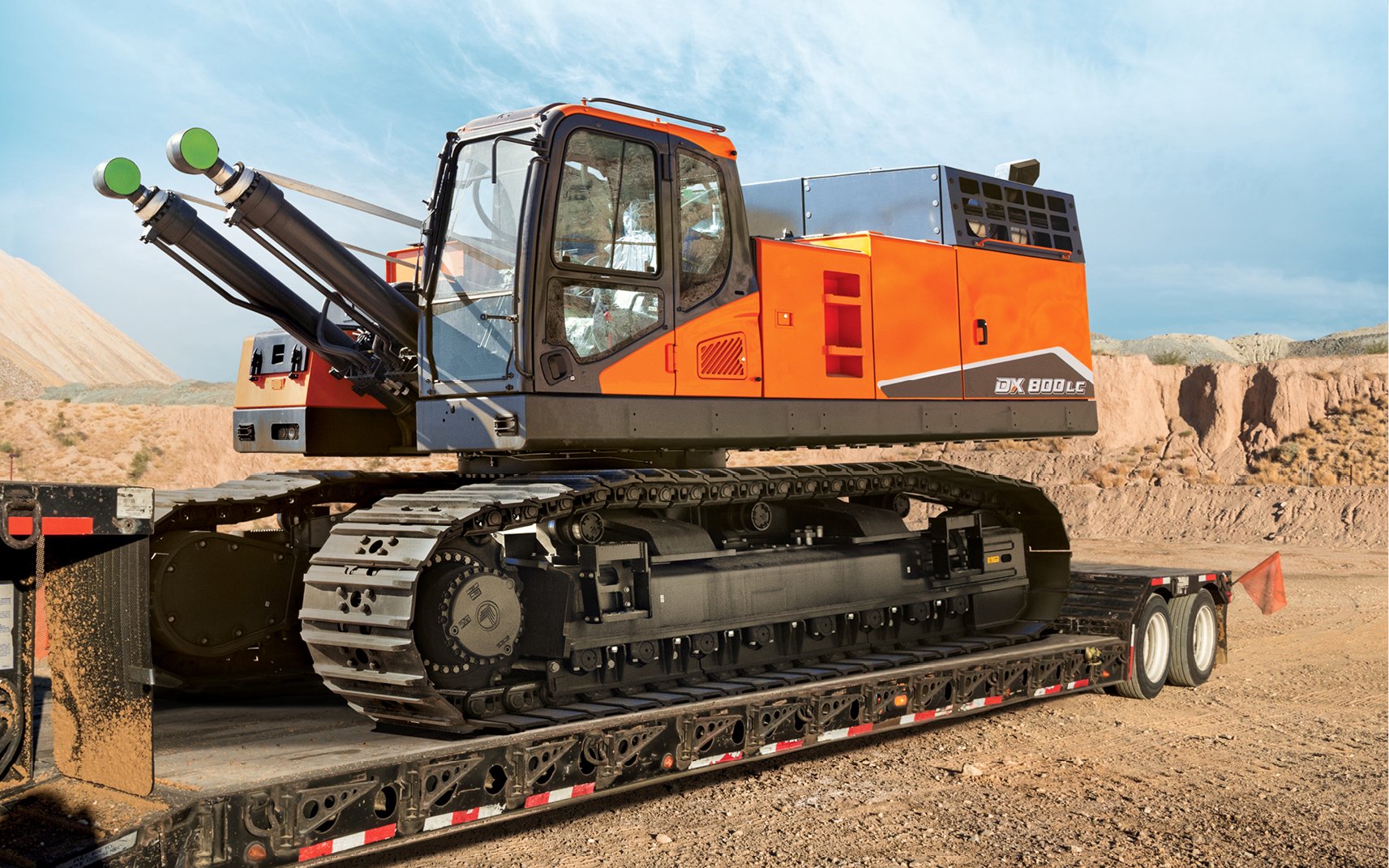 A DEVELON crawler excavator is loaded up for transport to the next job site.