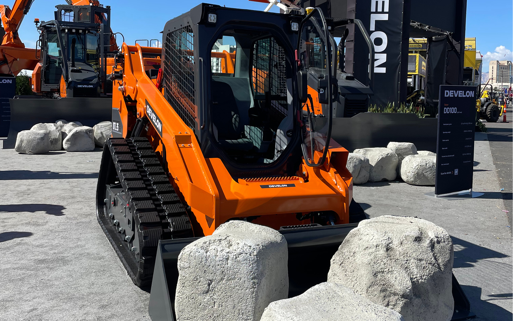 A picture of a DEVELON compact track loader with a bucket attachment on display at CONEXPO-CON/AGG.