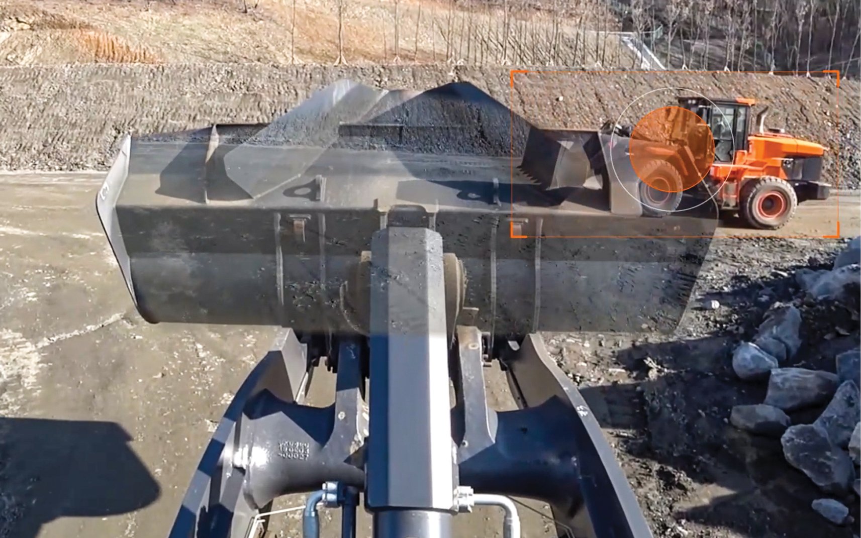 The DEVELON Transparent Bucket feature allows wheel loader operators to see through the bucket.