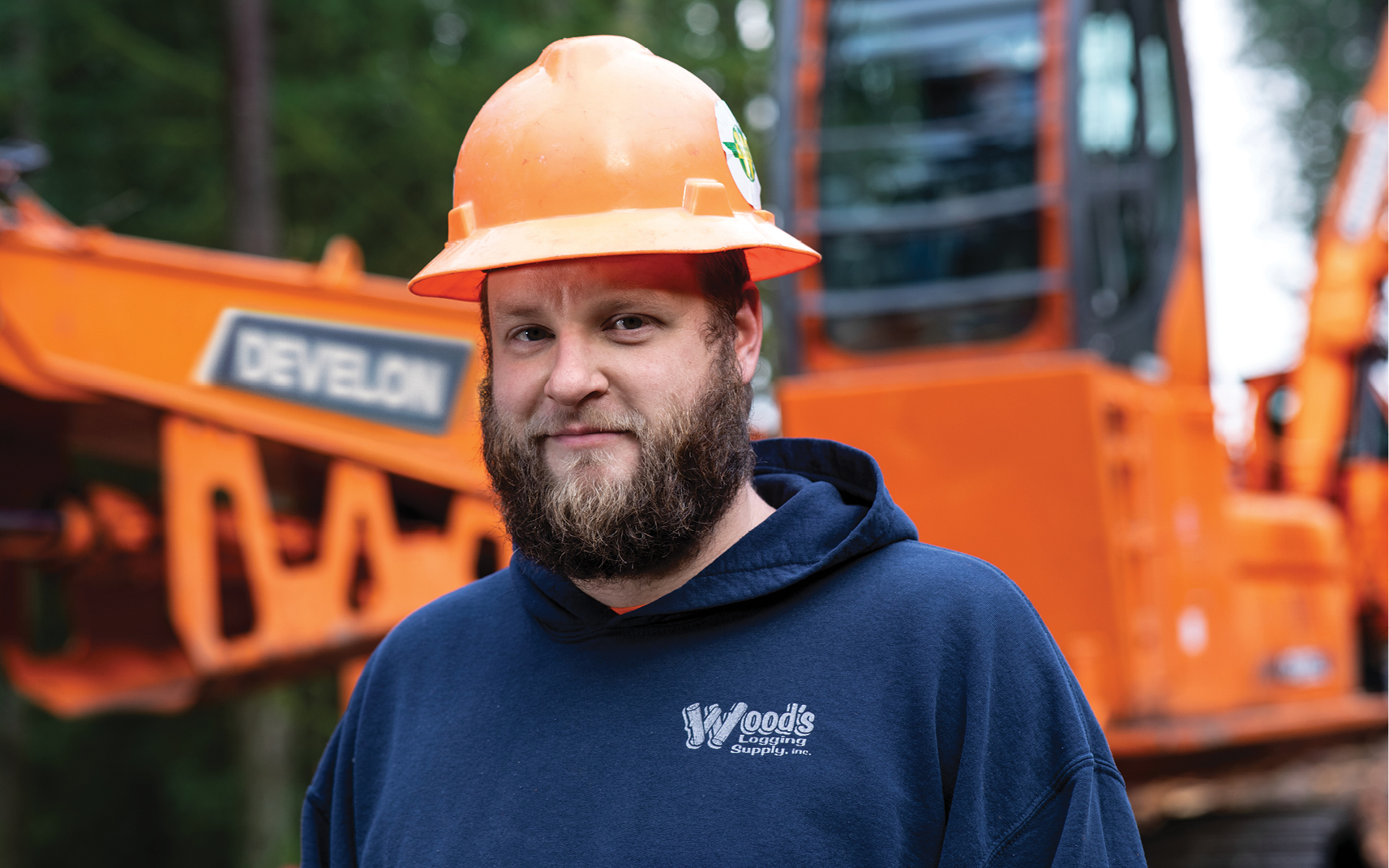 Shane Hiett, Hiett Logging, in front of his DEVELON logging equipment.